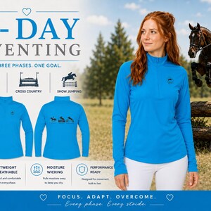 May include: A bright blue long-sleeve quarter-zip pullover featuring a small equestrian logo on the chest and a graphic on the back showing dressage, cross country, and show jumping icons. The text reads 3-DAY EVENTING, THREE PHASES. ONE GOAL.