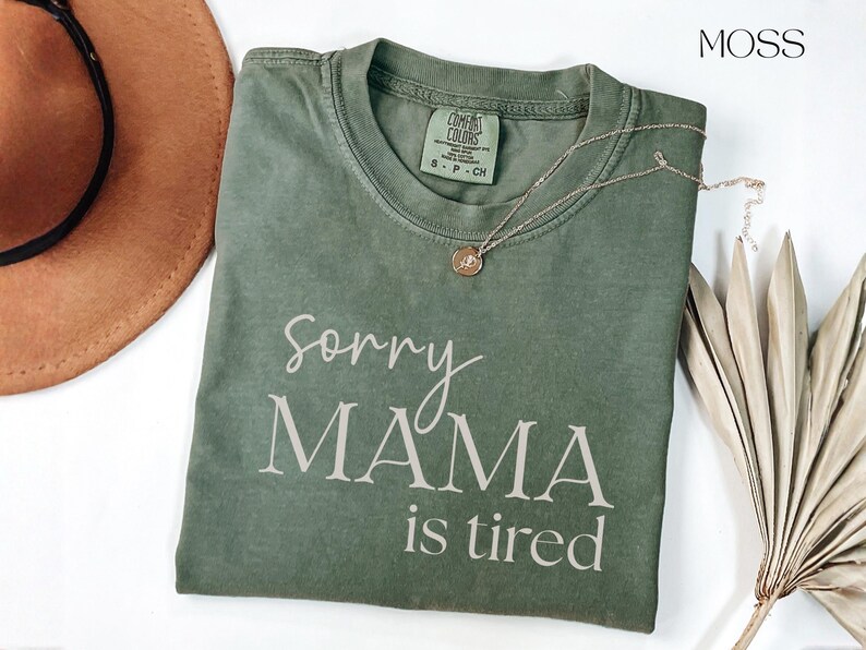 May include: A white ceramic mug with a black handle and the text "But First, Coffee" in a handwritten style. The mug is on a white surface. The mug is approximately 4 inches tall.