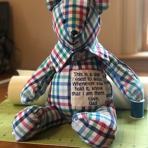 May include: A set of three ceramic mugs with a speckled, matte finish. The mugs are in shades of cream, light gray, and dark gray. Each mug has a simple, minimalist design, perfect for coffee or tea.