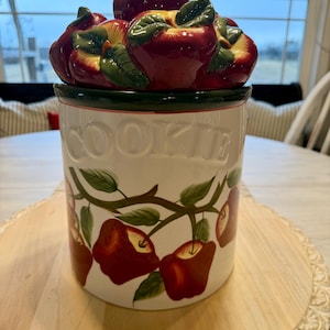 May include: A set of three ceramic nesting bowls in shades of blue, green, and white. The bowls feature a speckled glaze and a simple, modern design. The largest bowl measures approximately 6 inches in diameter.