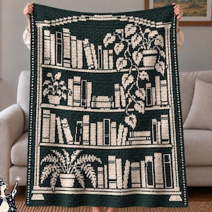 May include: A dark green and cream crochet blanket featuring a bookshelf design. The pattern displays rows of books arranged on shelves, interspersed with potted plants including a trailing vine and a fern, all rendered in a two-tone color scheme.