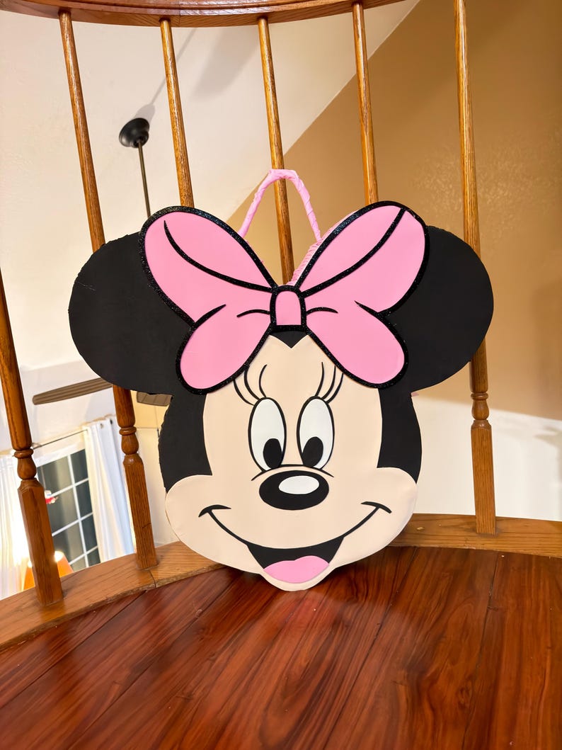 May include: A set of three ceramic nesting bowls in graduating sizes. The bowls feature a speckled, matte finish in shades of cream, light brown, and dark brown. The largest bowl measures approximately 8 inches in diameter.