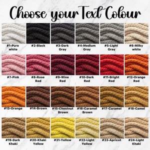 K&ouml;nnte beinhalten: Eine Farbkarte mit 24 verschiedenen Seilfarben, von Wei&szlig; bis Schwarz, Rosa, Rot, Orange, Braun, Gelb und Khaki. Der Text "Choose your Text Colour" steht oben. Jede Farbe ist mit einer Nummer und einem Farbnamen versehen.