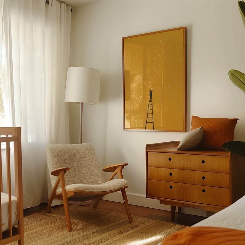 May include: A cozy bedroom scene featuring a wooden crib, a mid-century modern chair, and a wooden dresser. A framed yellow artwork with a person on a ladder is mounted on the wall. The room is illuminated by natural light and a floor lamp.