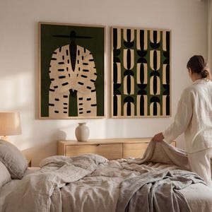 African-inspired set of two wall art prints with Black figure art and contemporary geometric shapes in deep olive, cream, beige and black.