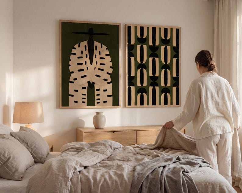 African-inspired set of two wall art prints with Black figure art and contemporary geometric shapes in deep olive, cream, beige and black.