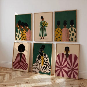 May include: A collection of six framed art prints featuring stylized illustrations of figures in patterned clothing. The artwork displays various color palettes including deep green, mustard yellow, pink, and cream, showcasing diverse geometric designs.