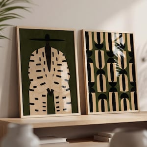 Afrocentric wall art set of two featuring a Black man portrait and coordinating African-inspired geometric print in olive green, beige and black.