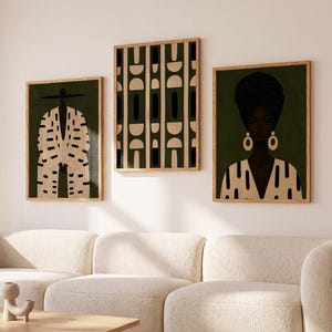 May include: A set of three framed wall art prints featuring a dark olive green background. The left print shows a figure in a patterned suit, the center print displays a geometric pattern, and the right print depicts a portrait of a person.