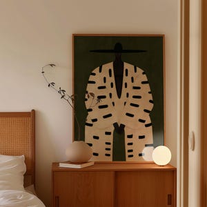 Afrocentric Black male portrait wall decor in a minimalist illustration style with earthy olive green, beige and black tones.