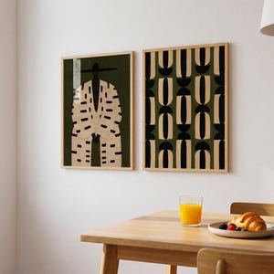 Modern Afrocentric wall art pair displayed above a cream sofa, featuring a Black male portrait and coordinating minimalist pattern.