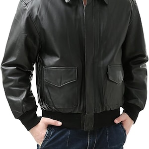 May include: Black leather jacket with a classic collar, two front pockets, and a ribbed hem and cuffs. The jacket has a zipper closure and a tailored fit, suitable for various occasions.