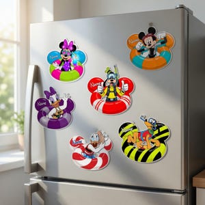 May include: A collection of colorful cartoon character magnets in the shape of Mickey Mouse ears. Each magnet features a different character in a floatation device, with the word "Name" on each. The magnets are displayed on a silver refrigerator.