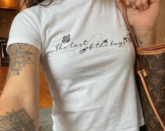 The Last Of The Bugs Vintage White Baby Tee - Cute Insect Graphic T-Shirt - Y2K Aesthetic Coquette Top - Minimalist Butterfly Crop Shirt