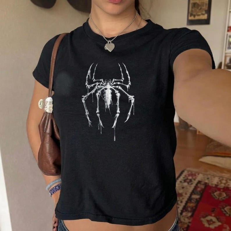 May include: A set of three ceramic mugs with a speckled, matte finish in cream, light grey, and dark grey. Each mug has a simple, modern design and a rounded handle.