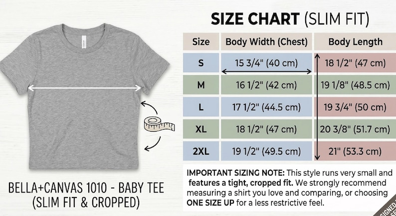May include: A grey Bella+Canvas 1010 baby tee, slim fit and cropped, with a size chart showing body width and length measurements in cm. Sizes range from S to 2XL, with body widths from 40 cm to 49.5 cm. The tee is designed for a tight, cropped fit.