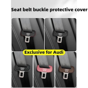 May include: Protective seat belt buckle covers in various colors, including black, pink, and brown. Each cover features the Audi logo and is designed for a car's seat belt buckle. The text "Seat belt buckle protective cover" and "Exclusive for Audi" are visible.