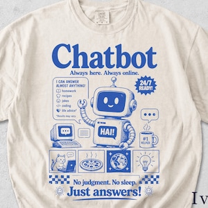 May include: Ivory-colored t-shirt with a blue graphic of a robot labeled "Chatbot." The design includes text: "Always here. Always online," "I can answer almost anything," and "No judgment. No sleep. Just answers!"