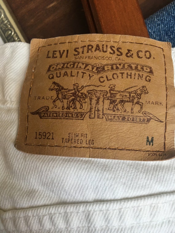 Vintage Levis 912 white jeans medium