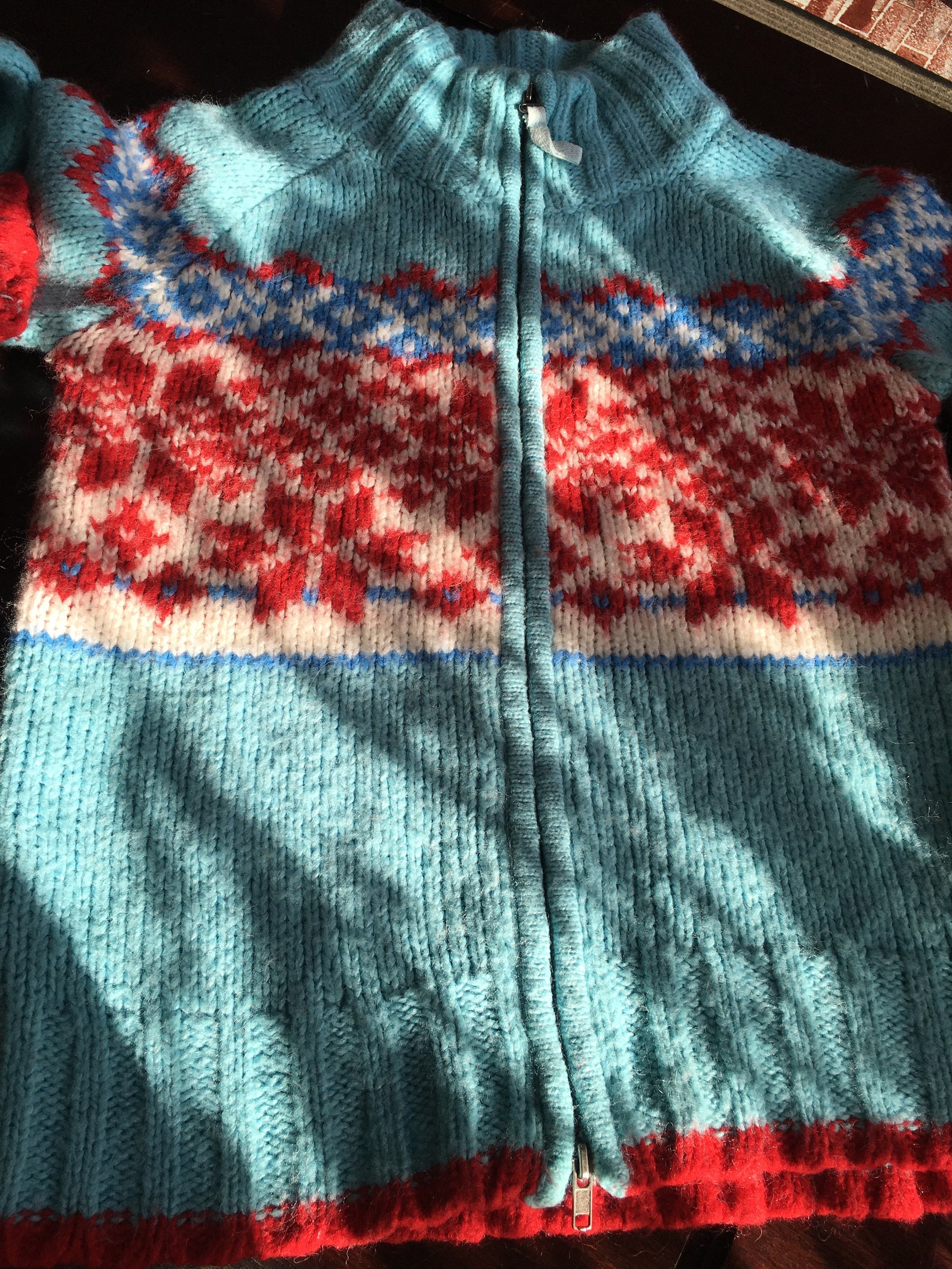 red and blue christmas sweater