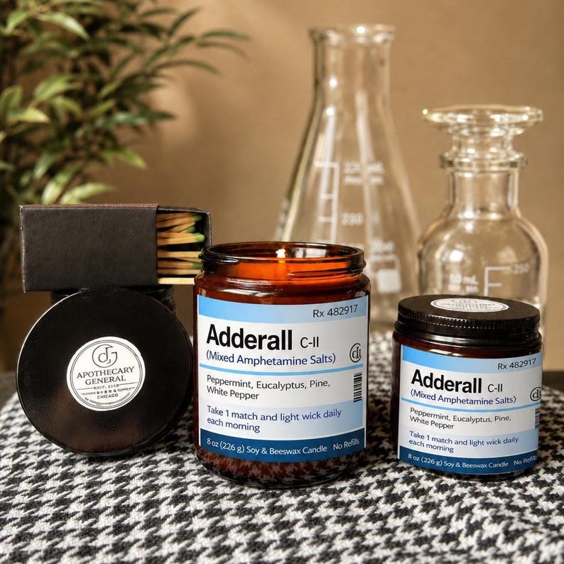 May include: Two amber glass candle jars with white labels reading Adderall C-II, Mixed Amphetamine Salts, Peppermint, Eucalyptus, Pine, White Pepper, 8 oz (226 g) Soy & Beeswax Candle. A black matchbox with a round Apothecary General logo label.