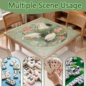 May include: A square table mat featuring a circular design with white cranes and pink lotus flowers on a light green background. The mat is displayed on a table with four chairs, showing various game pieces like dominoes, mahjong tiles, and playing cards.