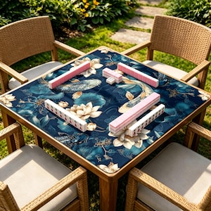 May include: A square wooden table with a dark blue floral patterned top, set for a game of Mahjong. The table is surrounded by four wicker chairs. The Mahjong tiles are pink and white.