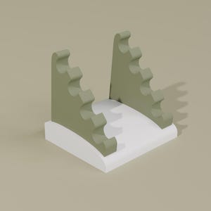 Op de afbeelding: Een minimalistische, abstracte sculptuur met twee saliegroene panelen met golfvormige randen die oprijzen uit een witte, gebogen basis. Het ontwerp is eenvoudig en modern, met een neutraal kleurenpalet.