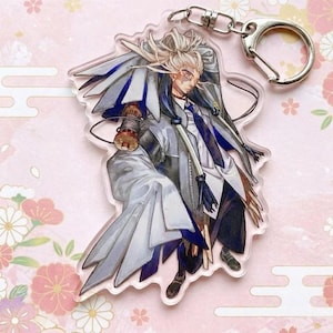 May include: A white ceramic mug with a black handle and the text "But First, Coffee" in a bold, black font. The mug is sitting on a wooden surface. The mug appears to be 12 ounces.