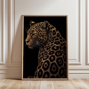 May include: A framed art print showcasing a golden leopard on a black backdrop. The leopard's coat is adorned with sparkling gold spots, creating a luxurious design. The artwork is presented in a wooden frame, adding a touch of elegance and sophistication to the piece.