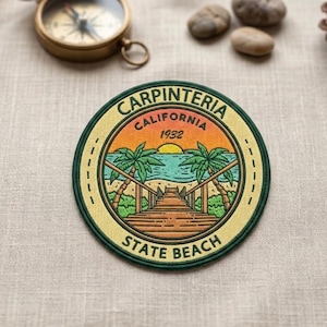 May include: Embroidered patch with a beach scene featuring palm trees, a wooden walkway, and the text "CARPINTERIA CALIFORNIA 1932 STATE BEACH" in a circular design. The patch has a yellow border and green accents.