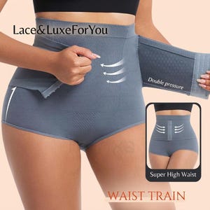 Könnte beinhalten: Graue High-Waist-Shapewear mit Doppel-Druck-Design. Das Kleidungsstück verfügt über einen Haken- und Ösenverschluss und einen stützenden Bund. Das Bild enthält den Text "Lace & Luxe For You", "Double pressure", "Super High Waist" und "WAIST TRAIN".