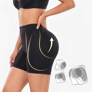 Puede incluir: Shorts moldeadores negros con cintura alta y diseño acolchado. Los shorts presentan un gráfico de flecha que indica el efecto lifting. Diagramas adicionales muestran la construcción de los shorts.