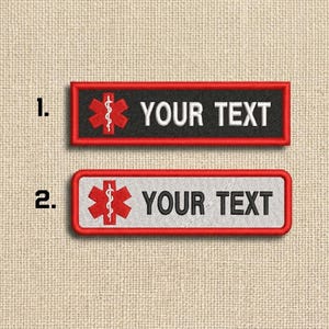 May include: Two rectangular embroidered patches. The top patch has a black background with a red border, a red medical symbol, and the text "YOUR TEXT" in white. The bottom patch has a white background with a red border, a red medical symbol, and the text "YOUR TEXT" in black.