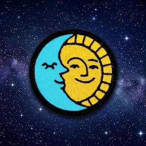 May include: A round embroidered patch featuring a smiling sun and moon design. The sun is yellow with a black outline, and the moon is light blue. The patch has a black border and is set against a starry night background.