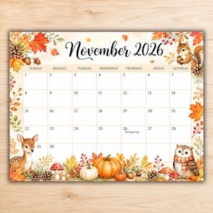 May include: A November 2026 calendar page featuring watercolor illustrations of autumn leaves, pinecones, berries, a squirrel, a deer, an owl, and pumpkins. The grid includes days of the week and dates, with Thanksgiving marked on the 26th.