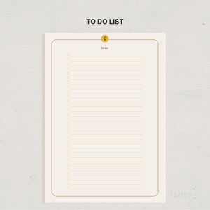 May include: A rectangular to-do list notepad with a cream-colored background and a thin gold border. The top center features a small gold circle with a Greek psi symbol. Below this, the text TO DO: sits above twenty-two horizontal lines.