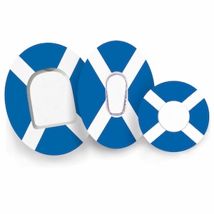 May include: Three adhesive patches featuring a blue and white Scottish flag pattern. The patches are oval and circular in shape, each with a central cutout designed to accommodate medical devices of varying sizes, including square and oval shapes.