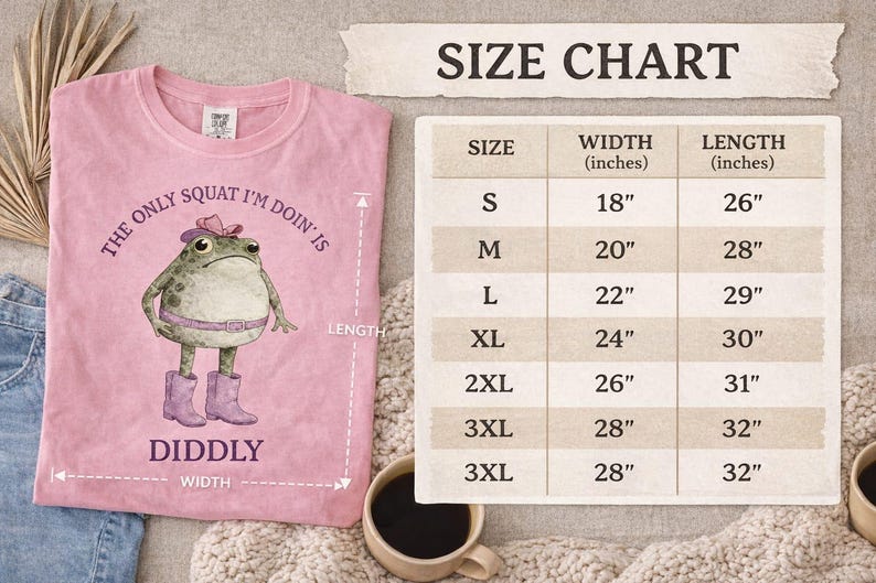 Puede incluir: Una camiseta rosa con el gr&aacute;fico de una rana que lleva sombrero, cintur&oacute;n y botas, junto al texto 'THE ONLY SQUAT I'M DOIN' IS DIDDLY'. Al lado hay una tabla de tallas que muestra anchos y largos en pulgadas para las tallas S a 3XL.