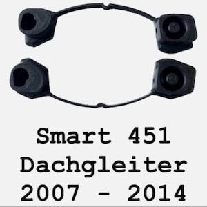 Könnte beinhalten: Schwarze Kunststoffteile Smart 451 Dachgleiter, passend für Modelle 2007-2014. Das Bild zeigt zwei Paare der Teile, jeweils mit einer kreisförmigen Öffnung und einem Verbindungsarm.
