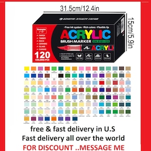May include: A black box of acrylic brush markers, 12.4 inches wide and 5.9 inches tall, with 120 colors. The box has the text "ACRYLIC BRUSH MARKER" and "120 COLORS/PCS". The image also includes a color chart.