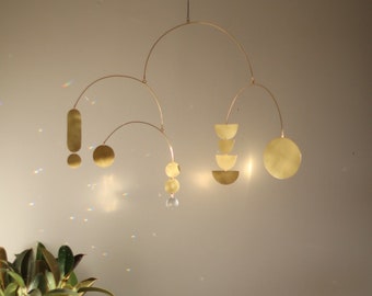 Starling kinetic brass mobile with glass crystal for modern nursery