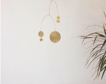 Wren kinetic handmade modern stylish interior mobile in brass