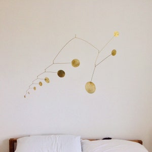 Lapwing kinetic handmade modern stylish interior mobile in brass