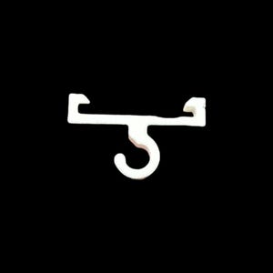 May include: A white plastic curtain hook, designed for ceiling mounting. It features a rectangular top with right-angled extensions at each end, and a curved hook hanging down from the centre.