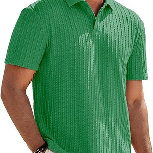 May include: A short-sleeved polo shirt in a vibrant green color featuring a vertical ribbed texture throughout the fabric. The shirt includes a classic collar and a partial button-down placket with matching green buttons at the neckline.