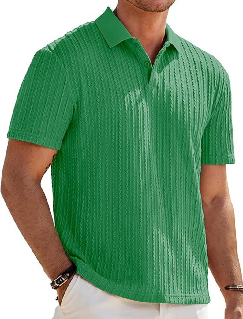 May include: A short-sleeved polo shirt in a vibrant green color featuring a vertical ribbed texture throughout the fabric. The shirt includes a classic collar and a partial button-down placket with matching green buttons at the neckline.