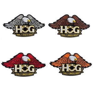 May include: Four embroidered patches featuring an eagle with outstretched wings. Each patch has the letters "HOG" and "HARLEY OWNERS GROUP" in gold lettering. The eagle's wings are in silver, brown, red, and orange.