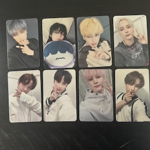 May include: Eight rectangular photo cards featuring young people with various hair colors and styles. The cards are arranged in two rows of four. The subjects are in various poses, some making hand gestures.