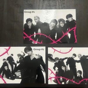 May include: A set of three ceramic canisters with lids. The canisters are white with a blue floral pattern. The largest canister is 8 inches tall, the medium is 7 inches, and the smallest is 6 inches.